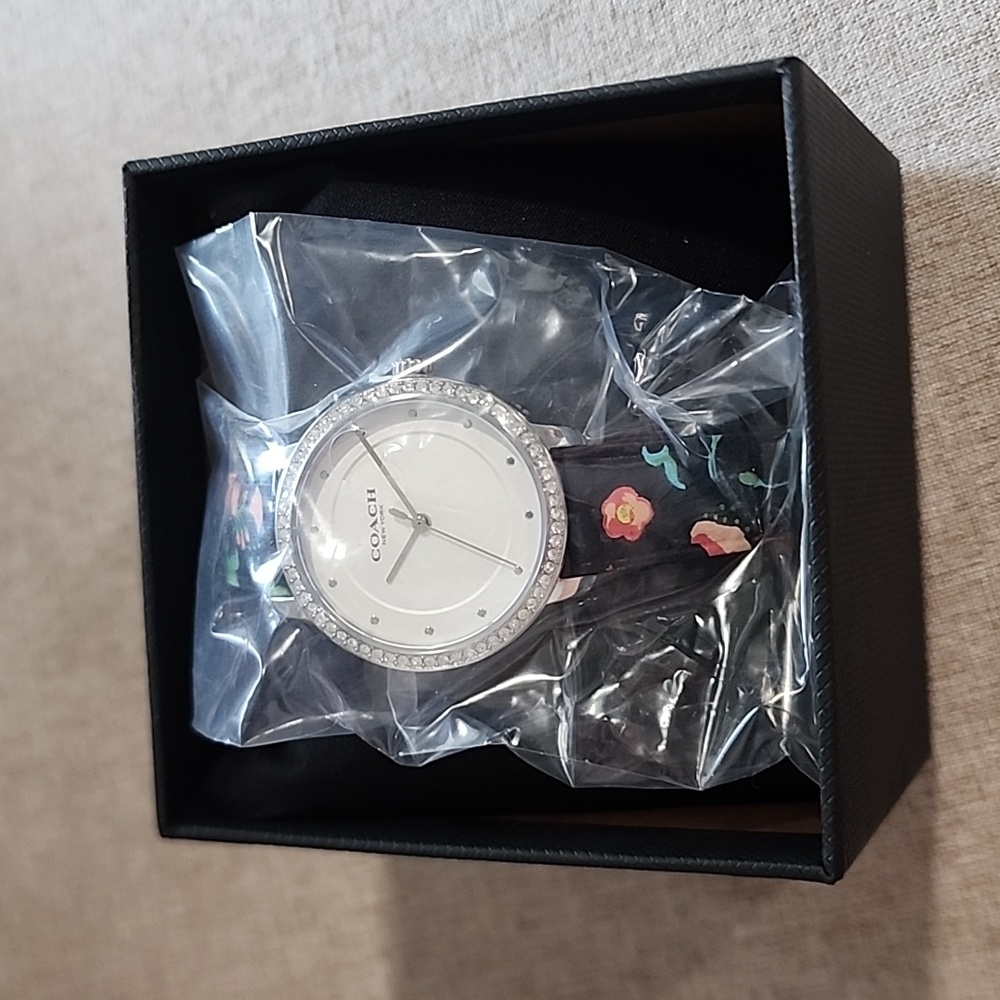 NEW! Coach watch. Floral band with jeweled rim. Genuine leather
